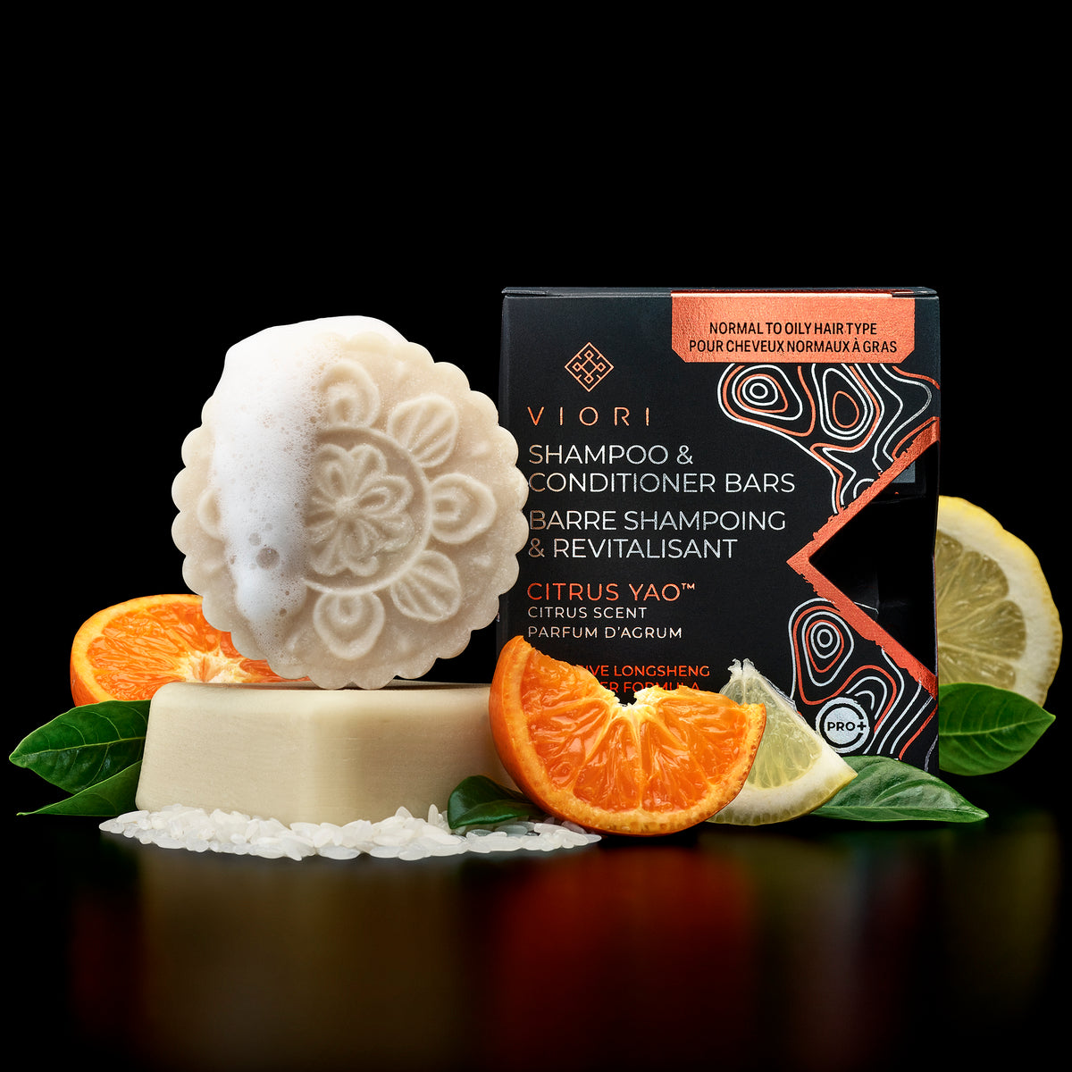 Citrus Yao shampoo and conditioner bars with their box, oranges and lemon