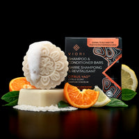 Citrus Yao shampoo and conditioner bars with their box, oranges and lemon