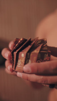 Video: hands holding a stack of Viori Men's bar boxes