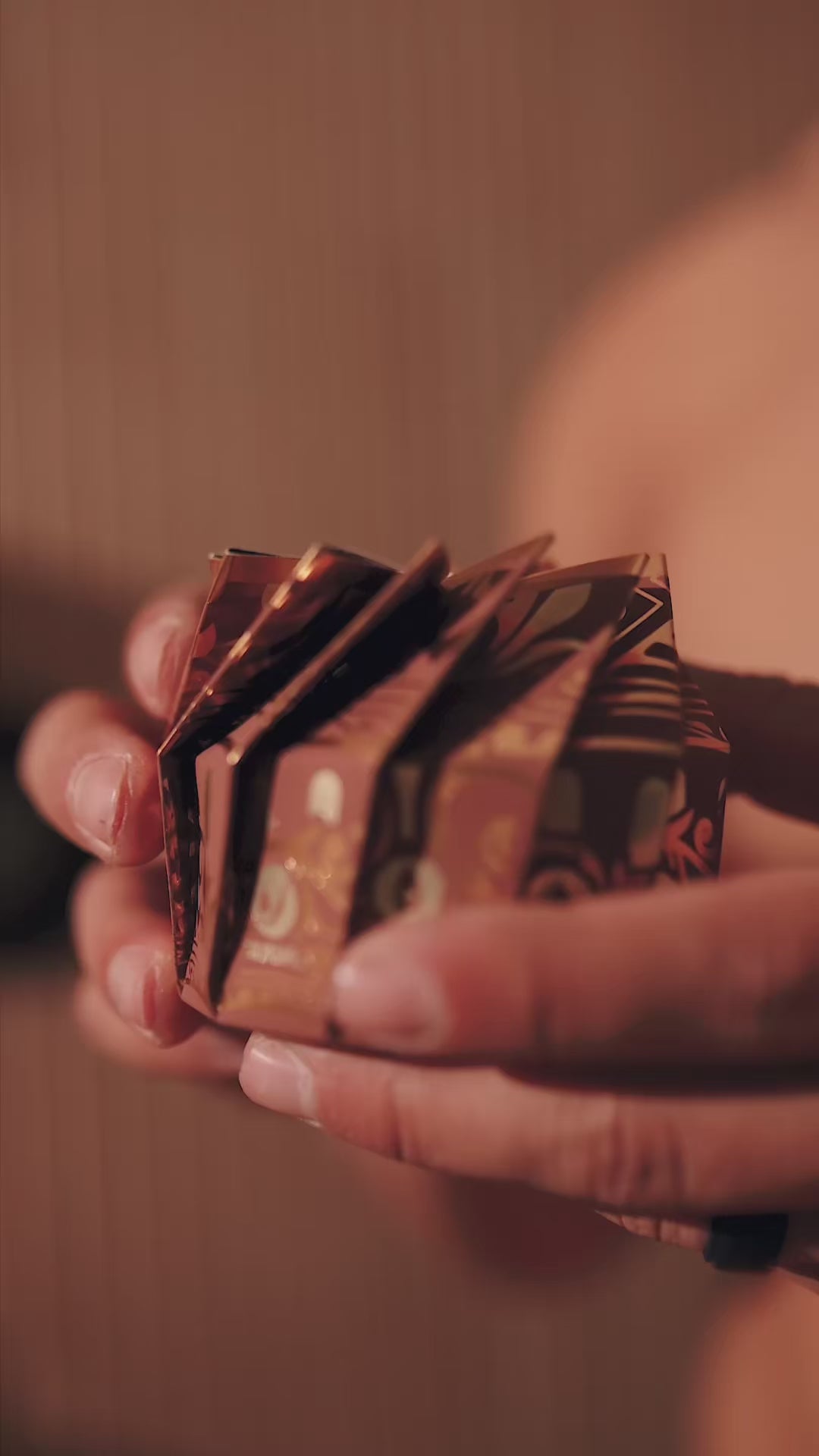 Video: hands holding a stack of Viori Men's bar boxes