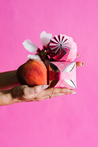 Viori Peach Hibiscus Conditioner Bar with pink packaging, a peach, and a hibiscus flower