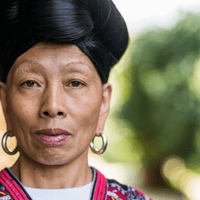 Video: Red Yao woman from Longsheng with her long hair wrapped on top of her head