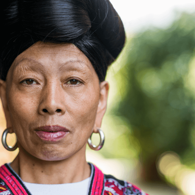 Video: Red Yao woman from Longsheng with her long hair wrapped on top of her head